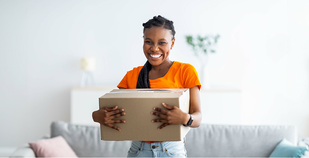 Customer with a parcel delivery in hand